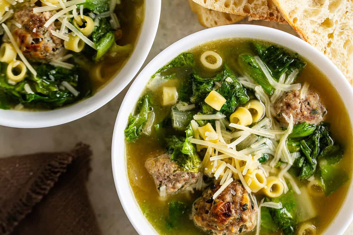 Overhead image of two bowls of wedding soup Italian.