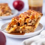 slice of pie with caramel sauce on a plate
