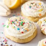 Ricotta cookies with frosting and sprinkles.