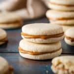 Two alfajores cookies stacked on top of one another.