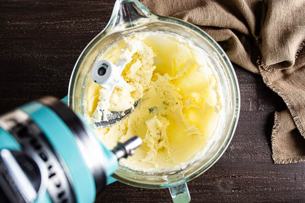 Blending in the dry ingredients for Basque cheesecake in a mixer.