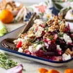 Beet salad on an enameled tray.