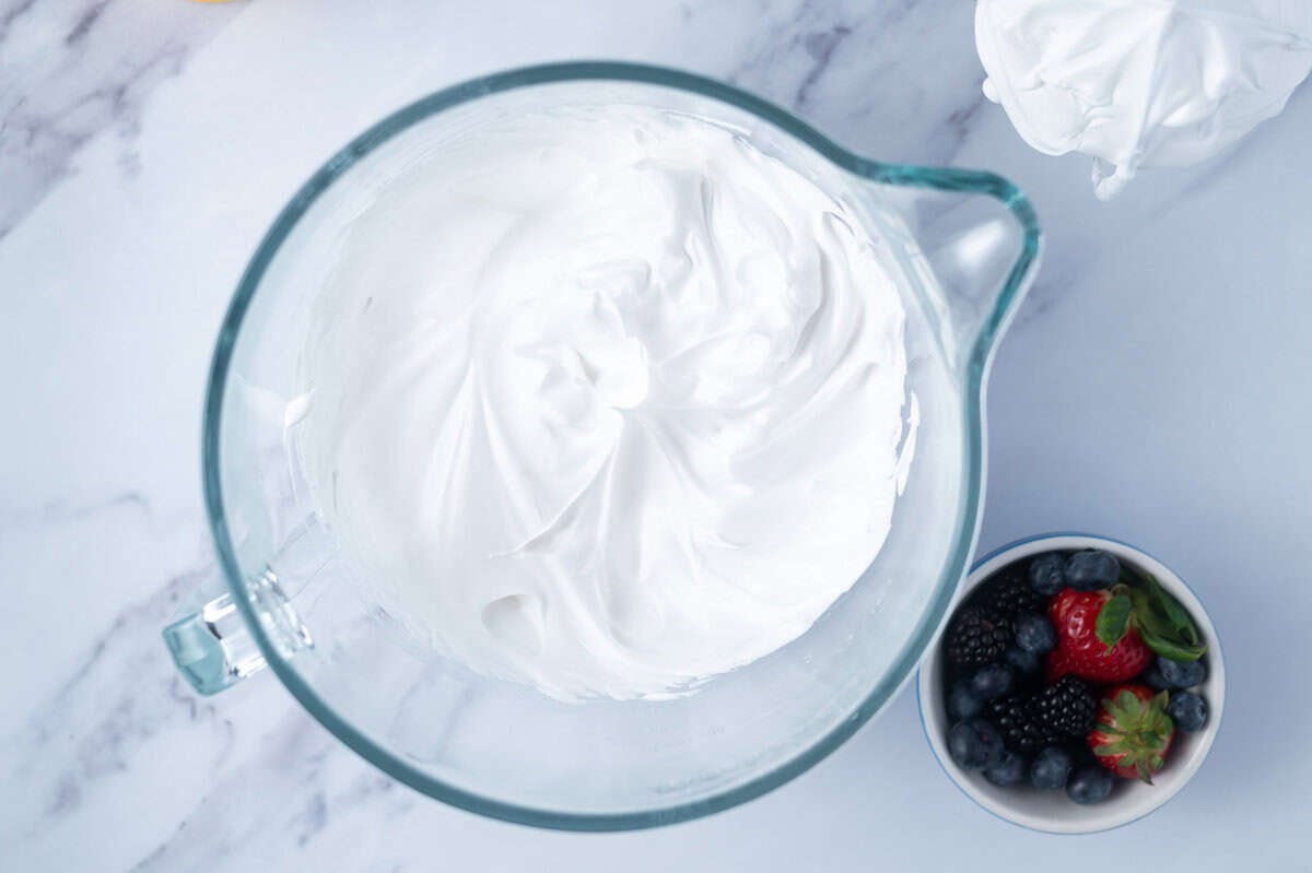 meringue whipped to stiff peaks in a mixing bowl