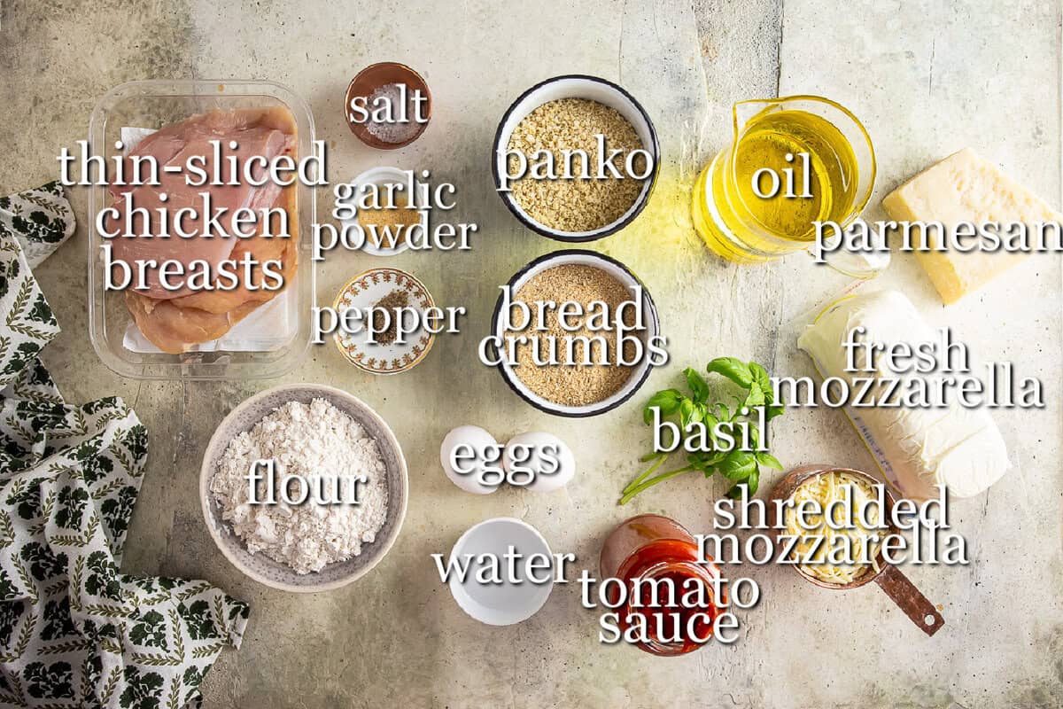 Ingredients for chicken parmesan in separate containers.