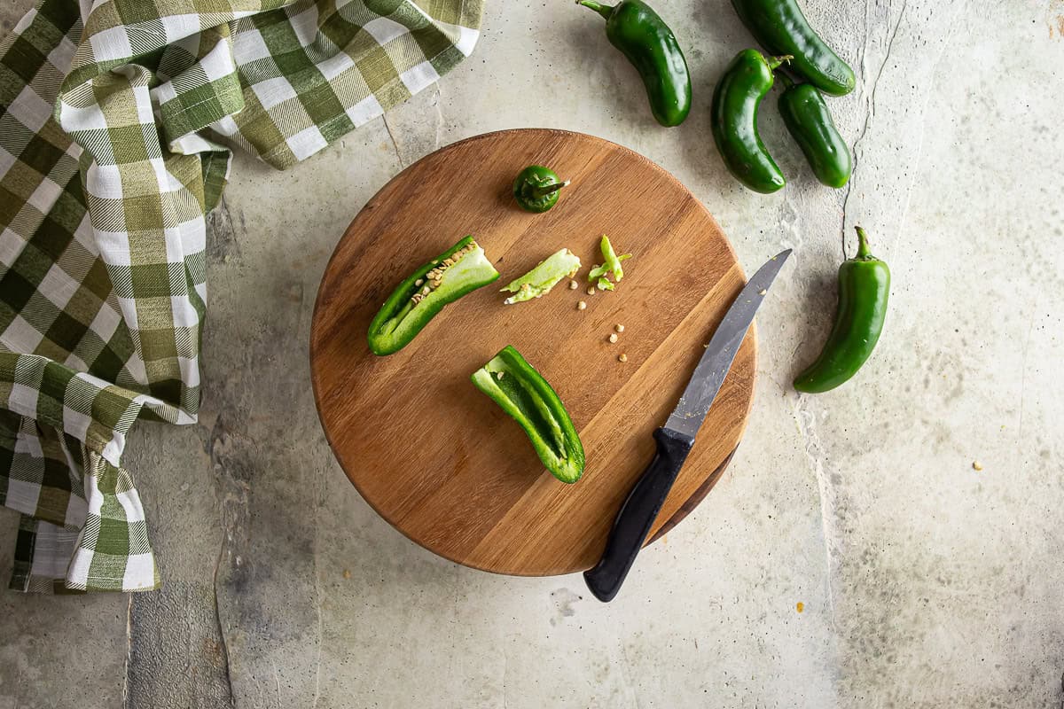 Seeding jalapenos for jalapeno popper pizza.