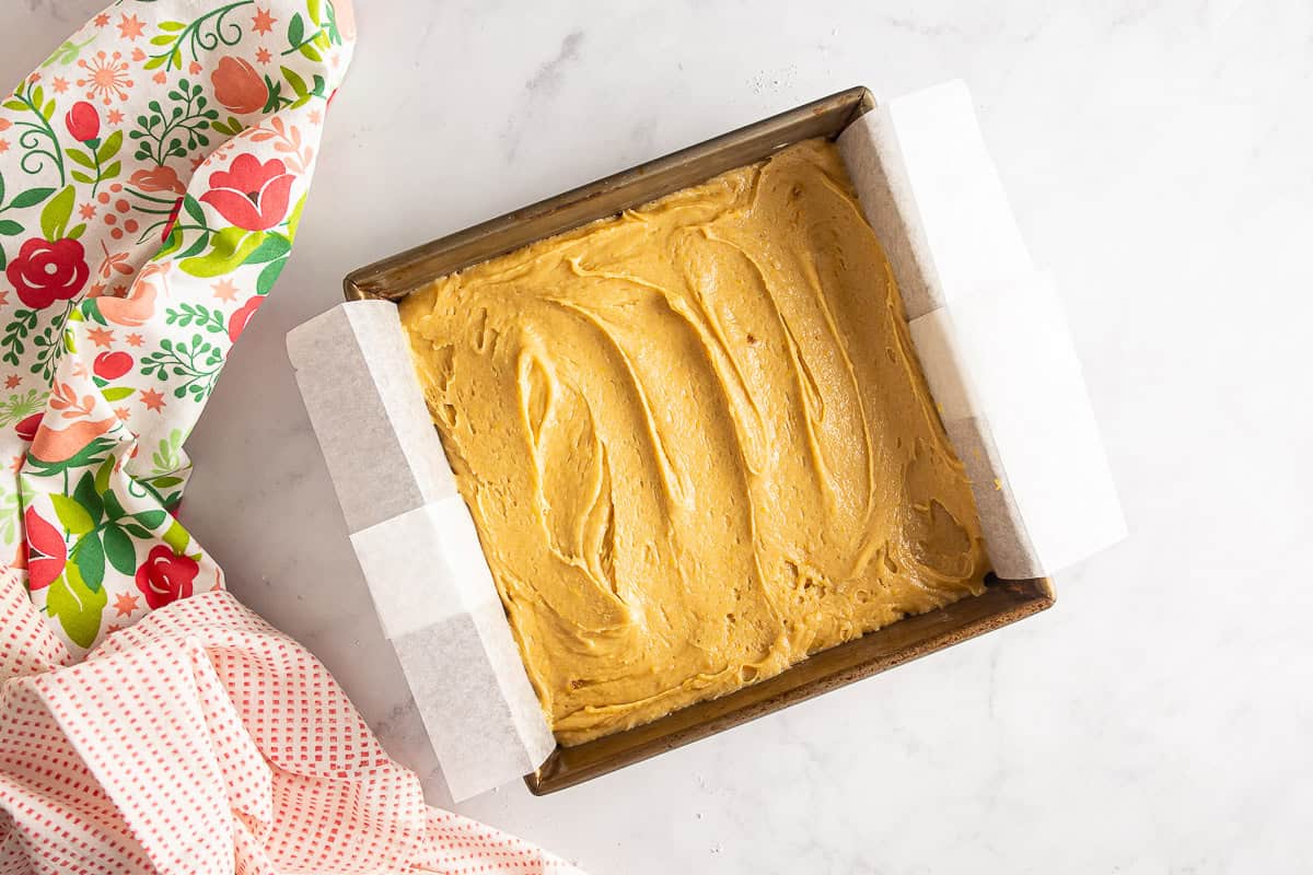 Blondie batter in a prepared pan.