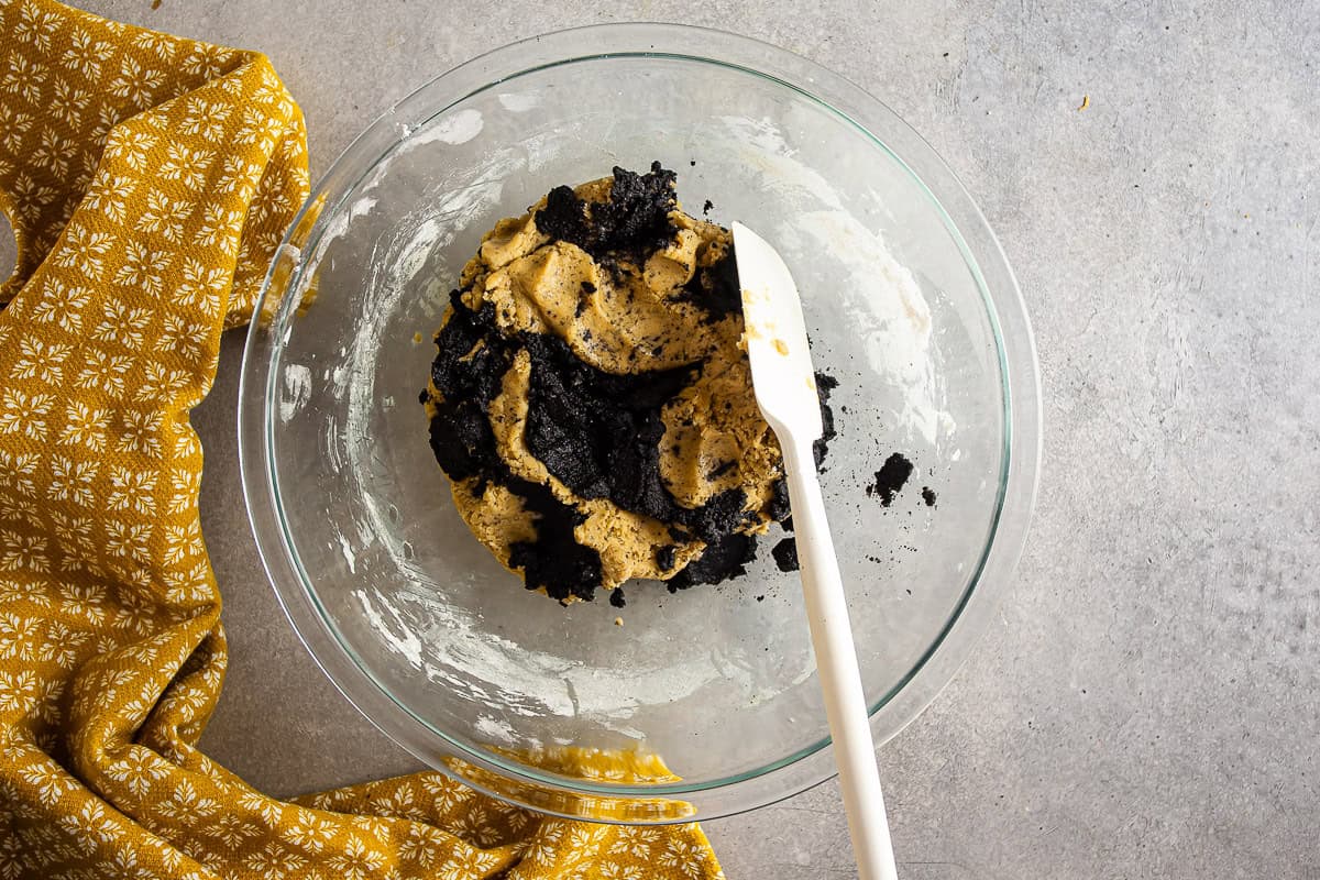 Swirling the tahini mixture into the cookie dough.