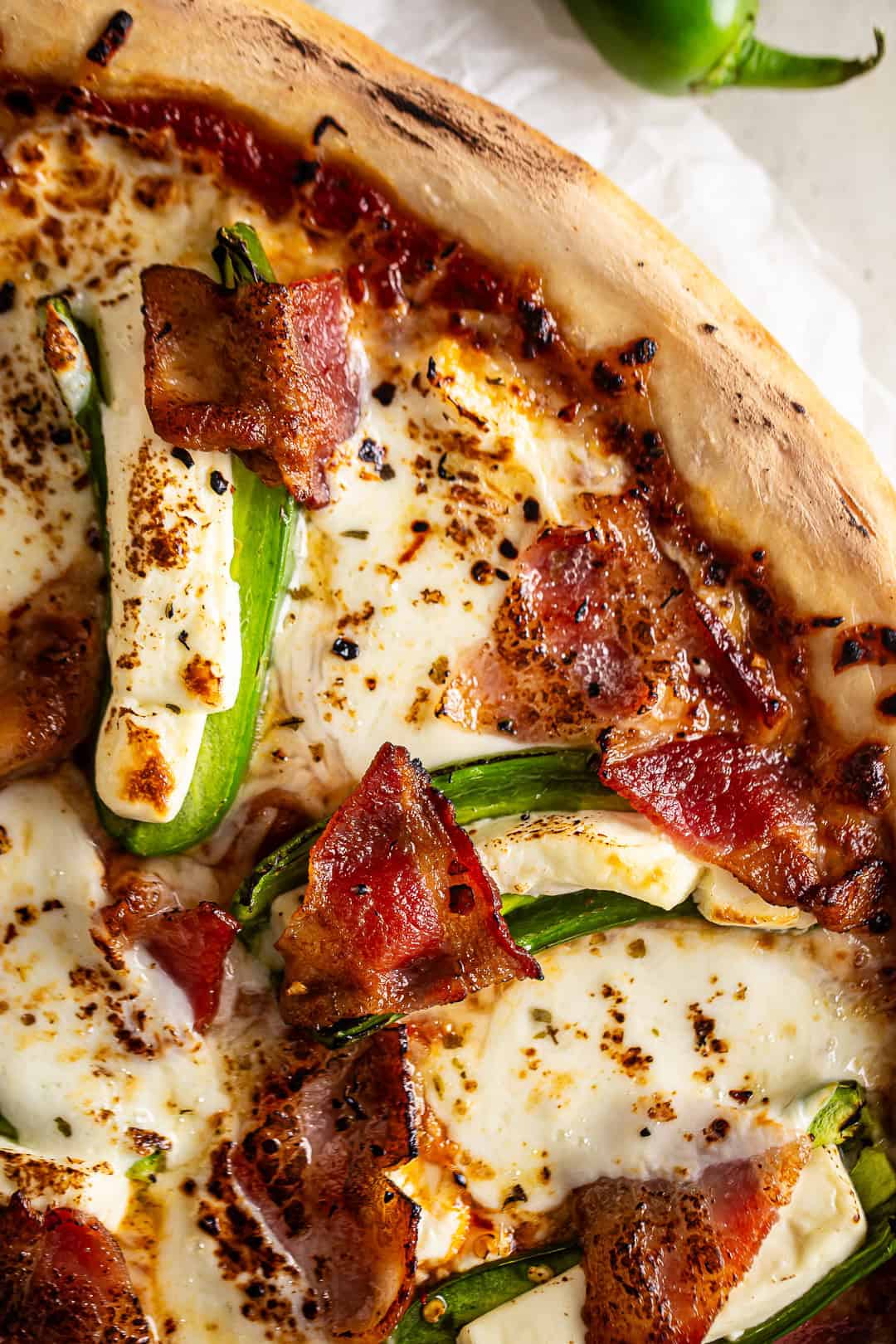 Close-up of jalapeno popper pizza after being baked.