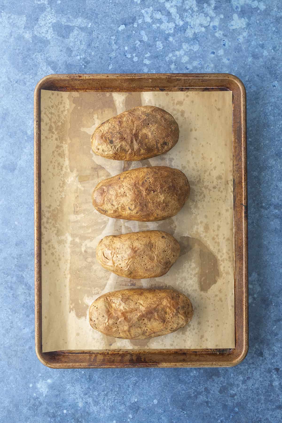 Baked potatoes on pan
