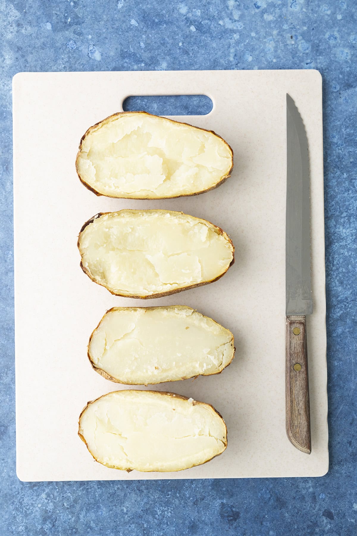 Baked potatoes halved lengthwise