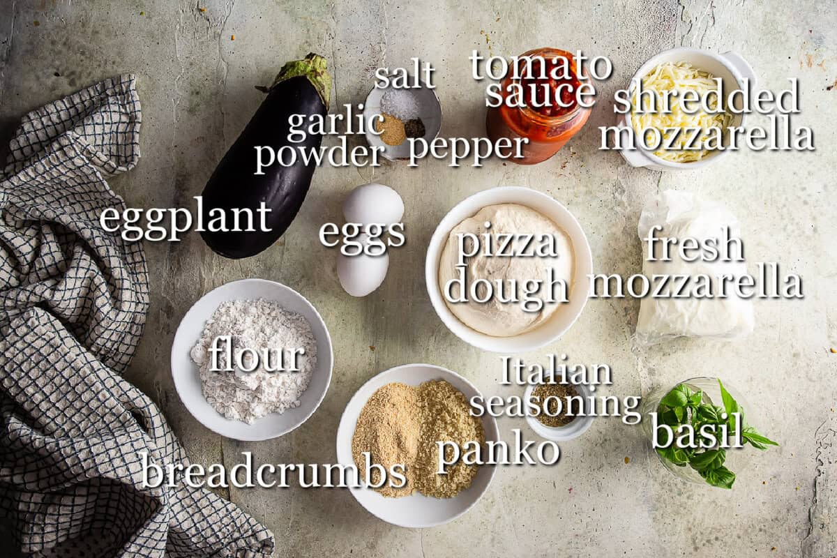 Ingredients for eggplant parmesan in separate containers on a neutral background.