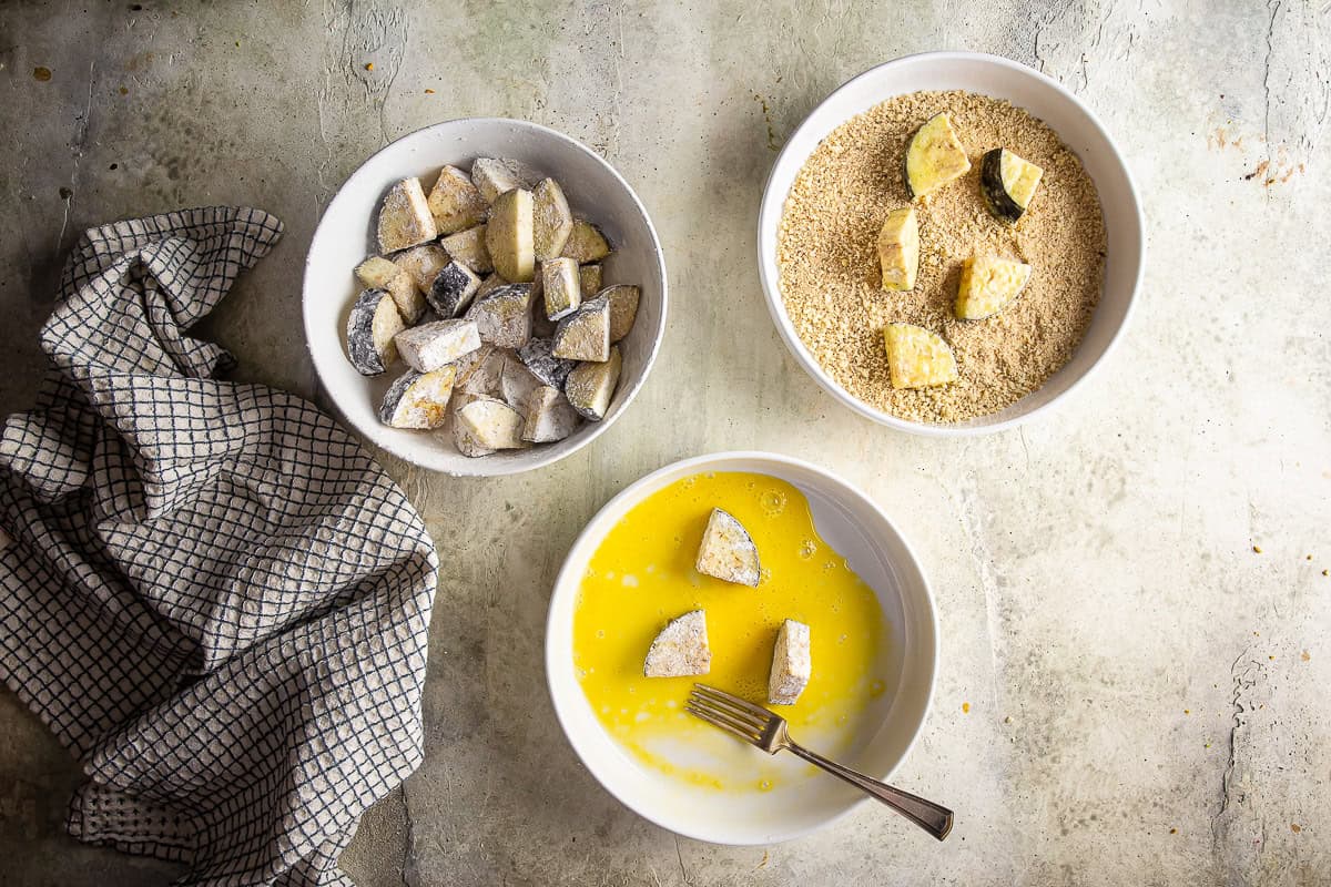 Breading eggplant for eggplant parmesan pizza.