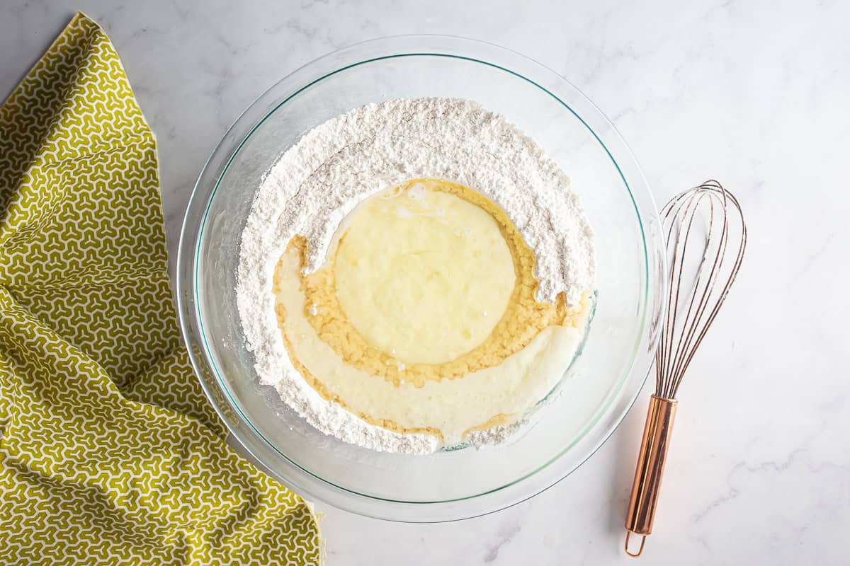 A well formed in the dry ingredients with the wet ingredients placed in it before whisking.