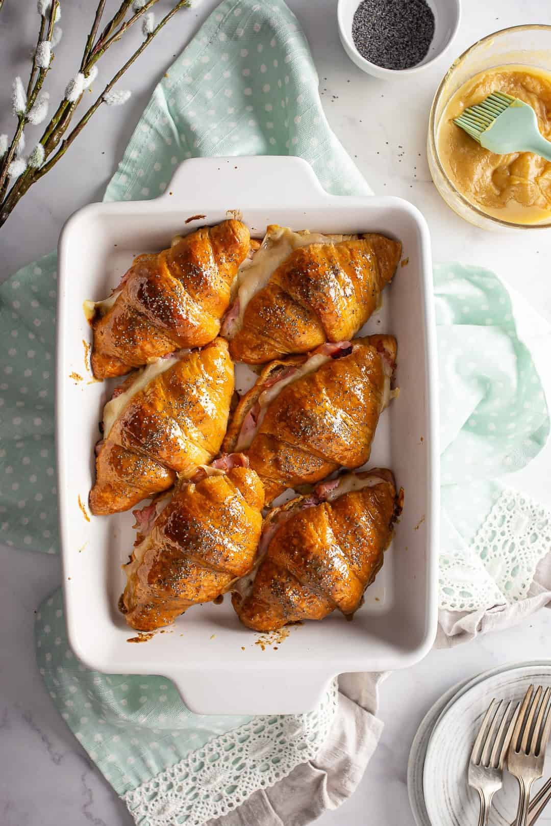 Baked ham and cheese croissant sandwiches.