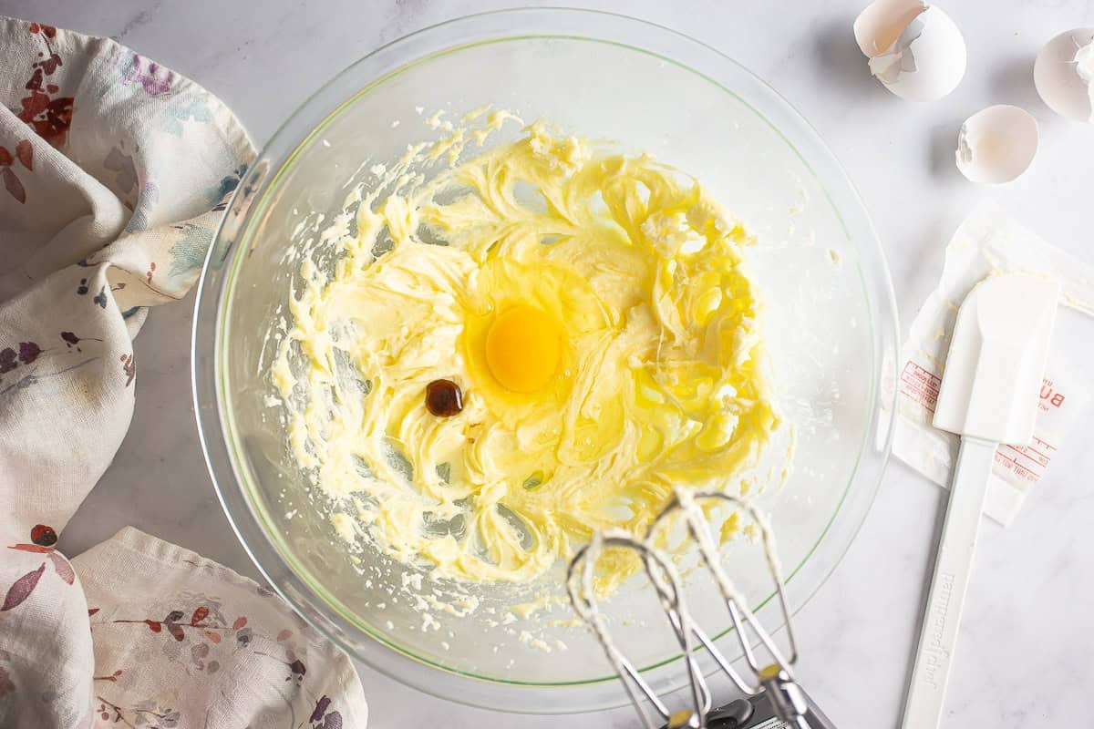 Adding extracts to the almond roll filling.