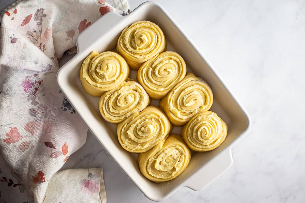 Risen almond rolls before being baked.