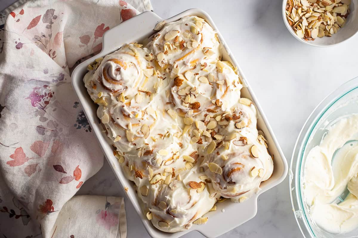 Finished almond rolls with almonds sprinkled on top.