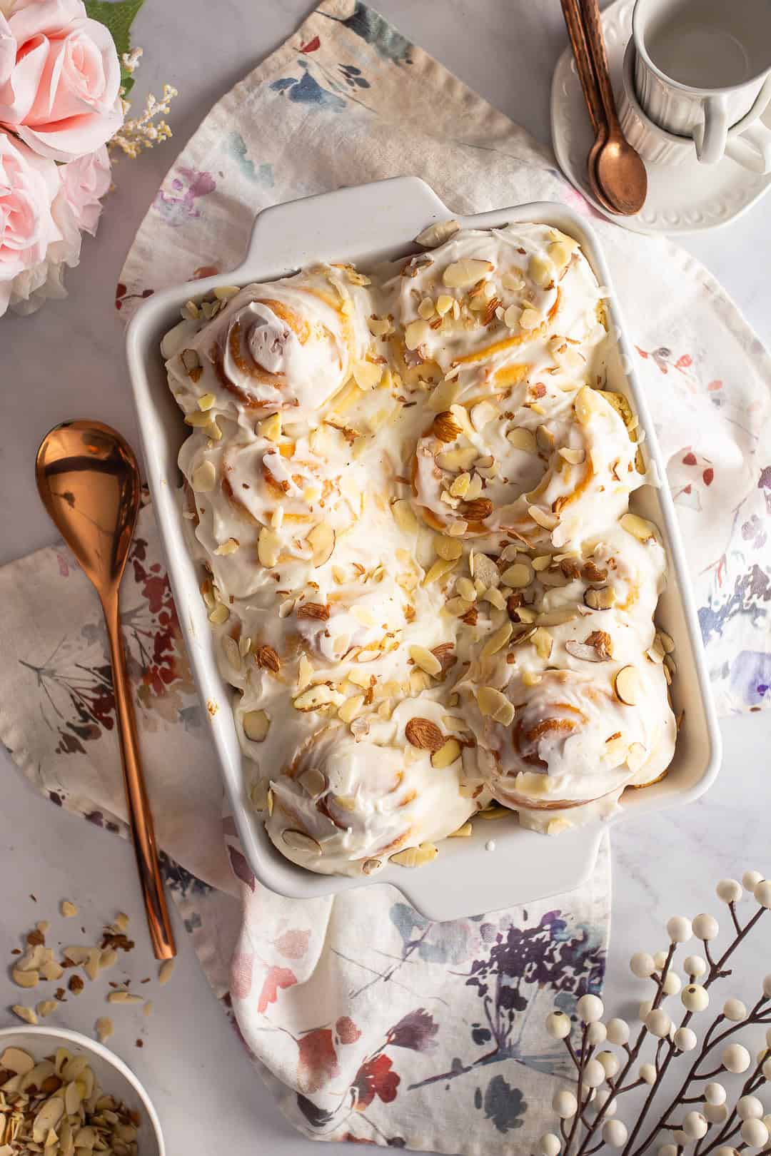 Almond rolls after being iced and garnished with almonds.
