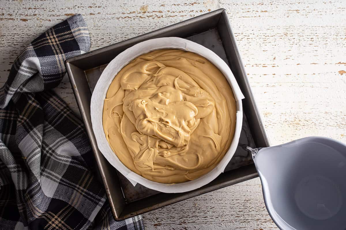 Unbaked Biscoff cheesecake in a water bath.