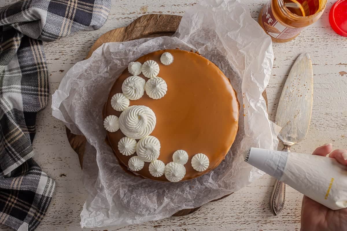 Whipped cream after being piped onto the Biscoff cheesecake.