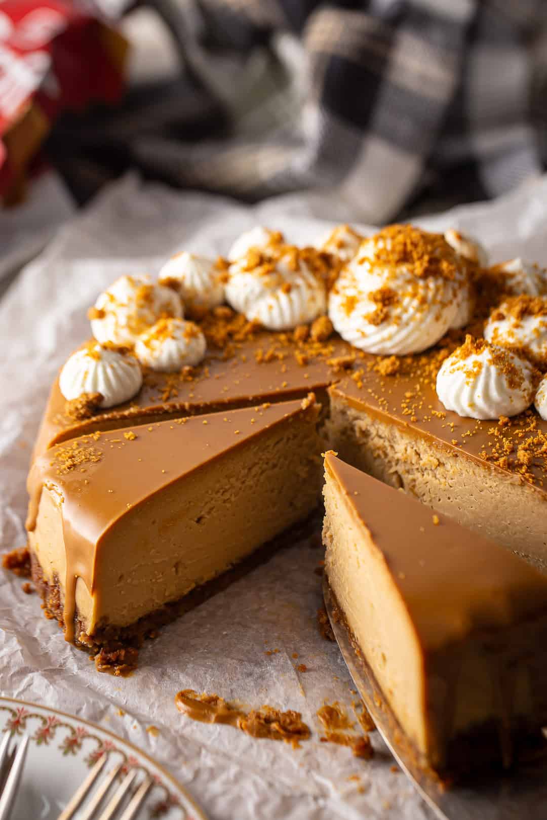 Biscoff cheesecake with a slice removed.