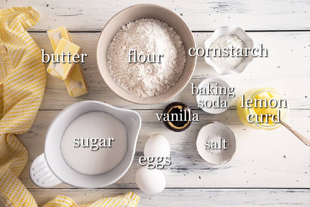 Lemon Meringue Pie cookie ingredients in separate containers on a wooden background.
