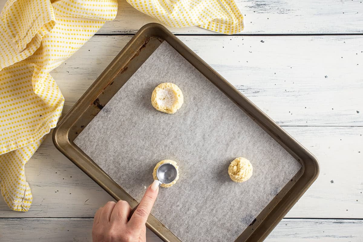 Shaping cookie dough for lemon meringue pie cookies.