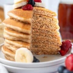 stack of banana pancakes cut to show soft, fluffy inside texture with text overlay