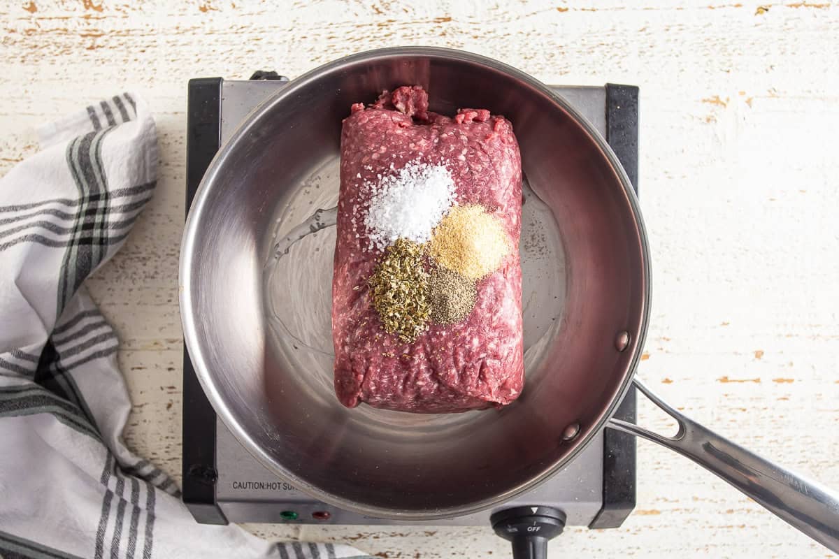 Meat and seasonings in a skillet for stuffed shells