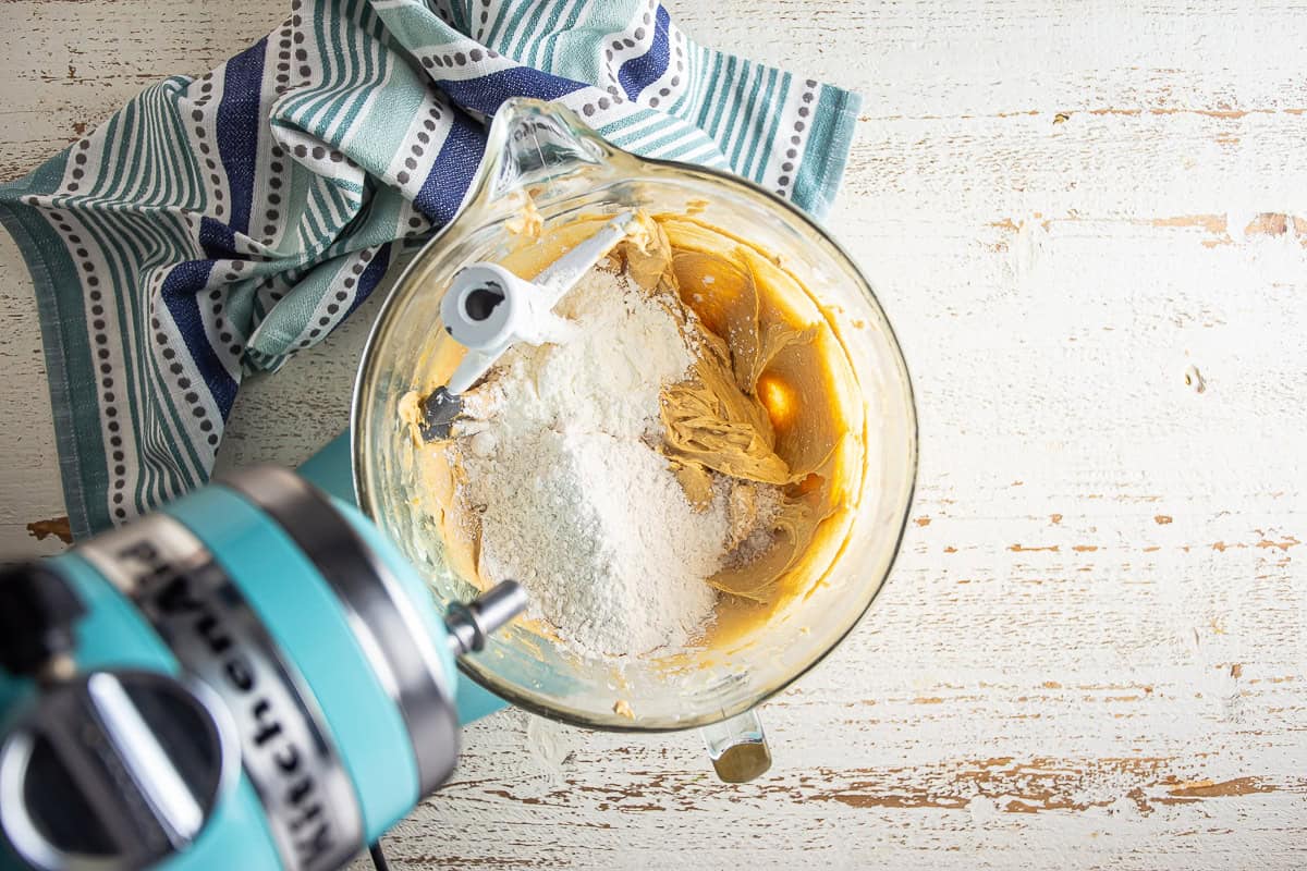 Adding dry ingredients to peanut butter cookies