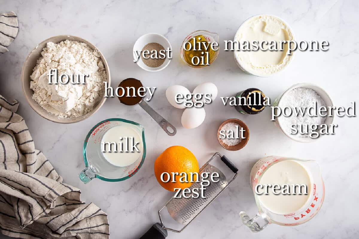 Maritozzi ingredients in separate containers on a gray background.