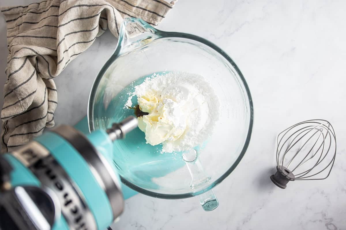 Mixing the mascarpone, vanilla, and powdered sugar for the maritozzi filling.