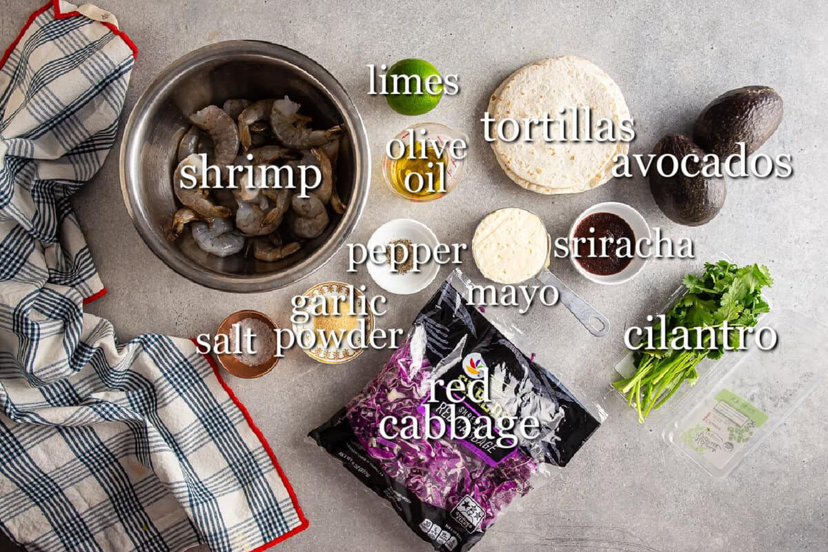 Ingredients for shrimp tacos in separate containers
