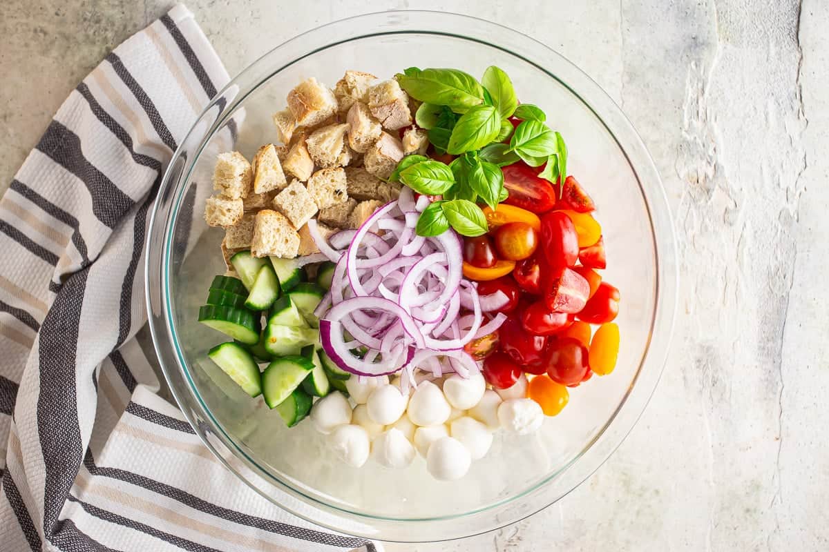 Ingredients for panzanella in a bowl before being mixed
