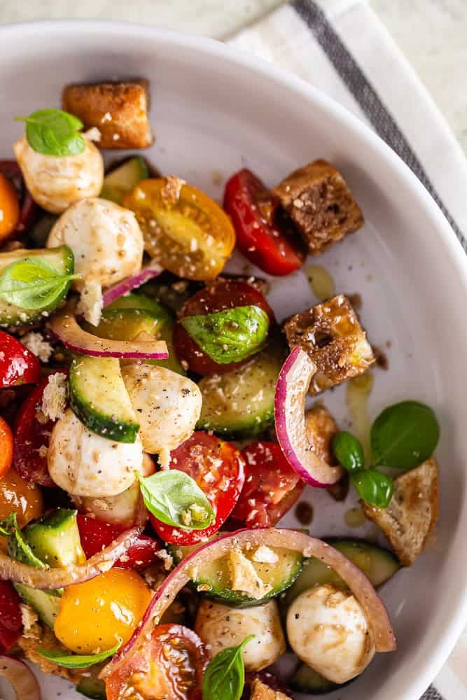 Panzanella salad in a white bowl