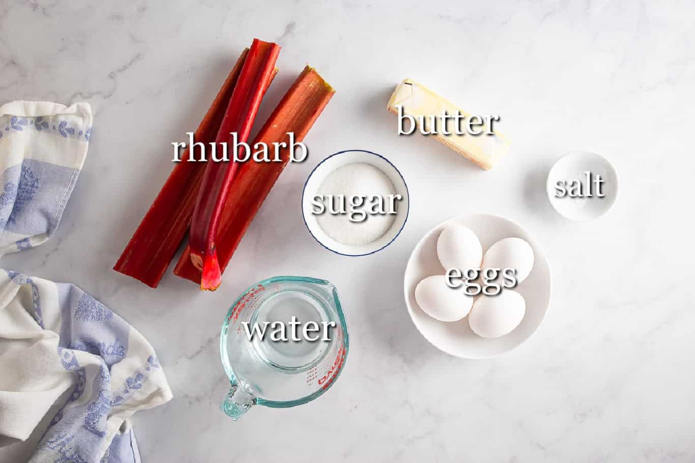 Ingredients for rhubarb curd in separate containers on a white background.