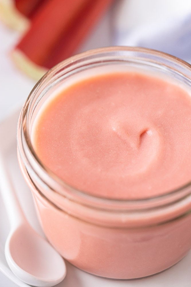 Rhubarb curd in a glass jar.