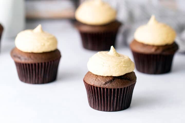 Peanut butter frosting on chocolate cupcakes