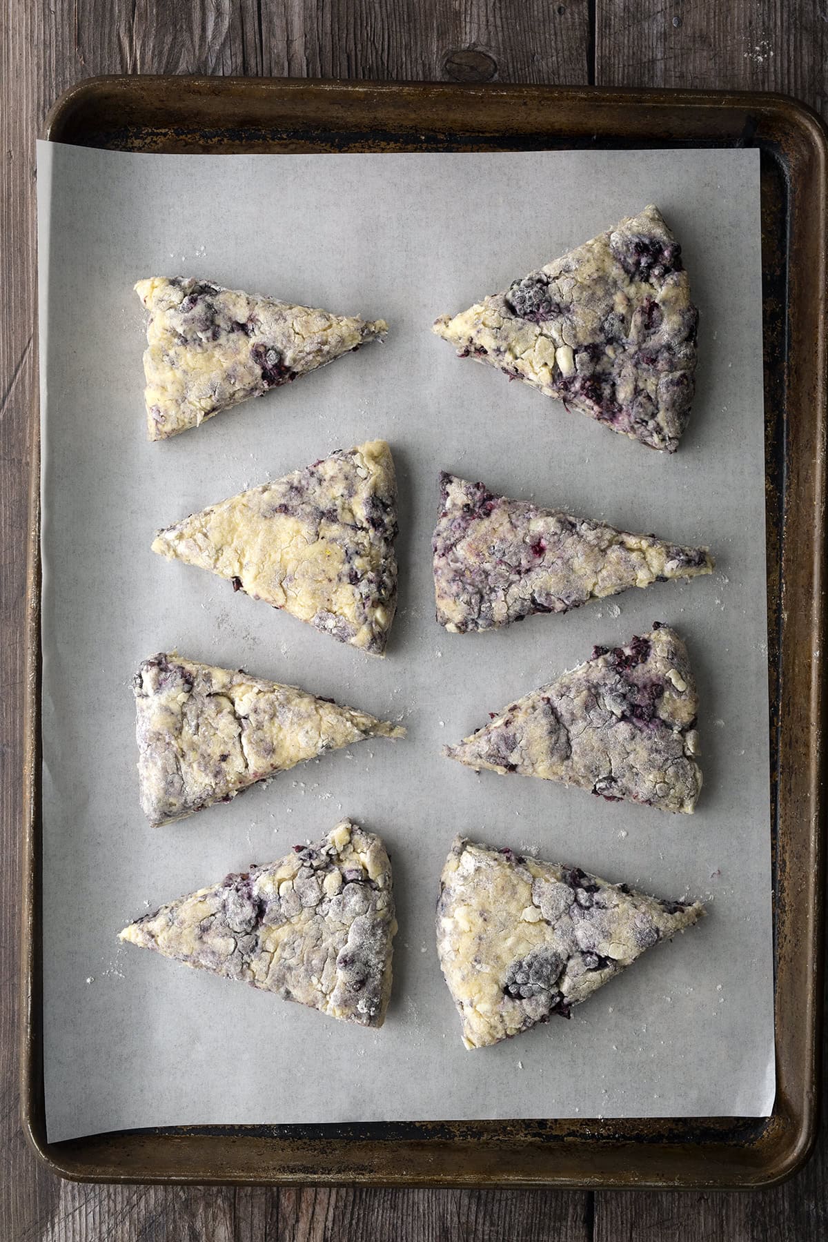 Raw scones on baking sheet