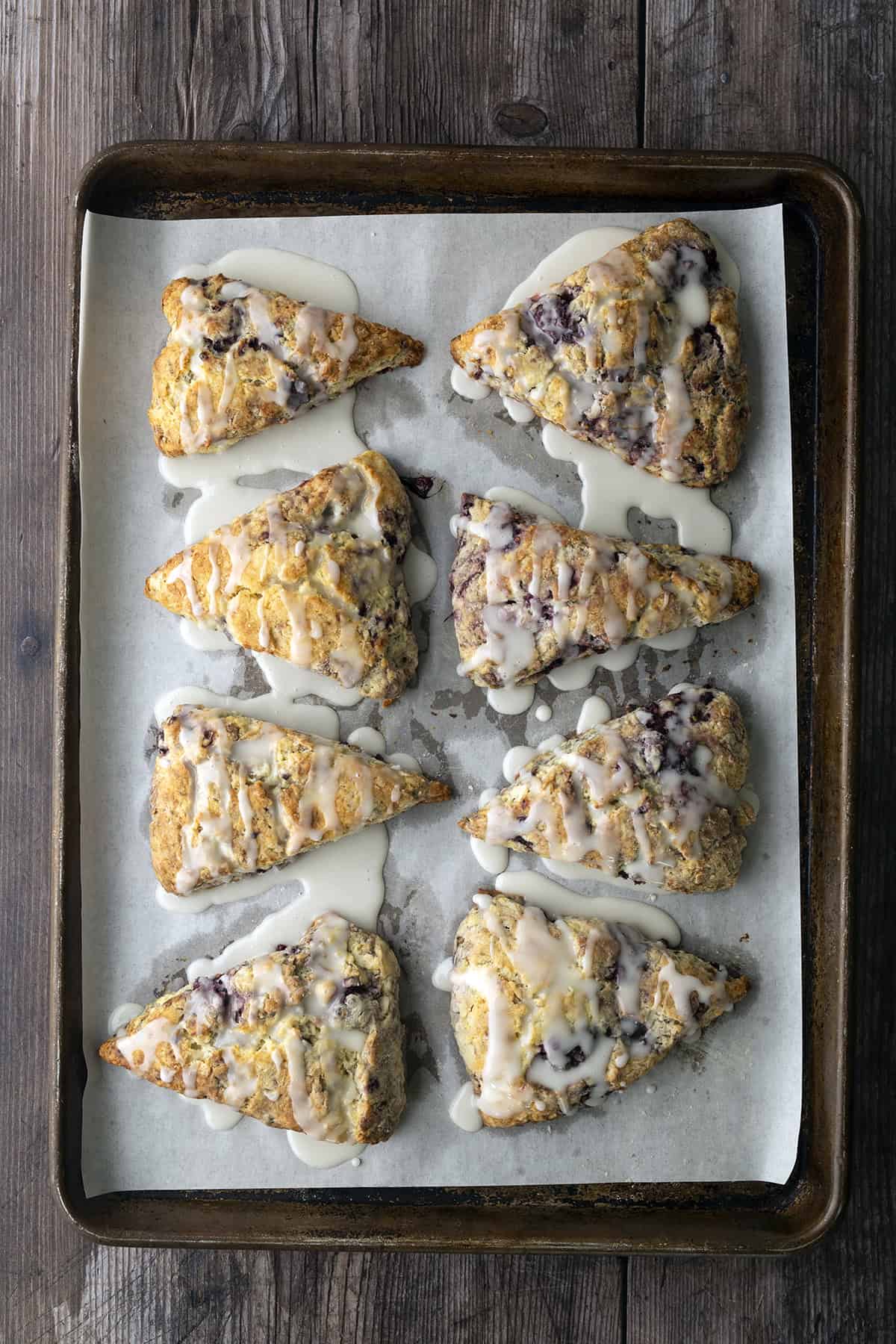 Lemon glaze drizzled over scones