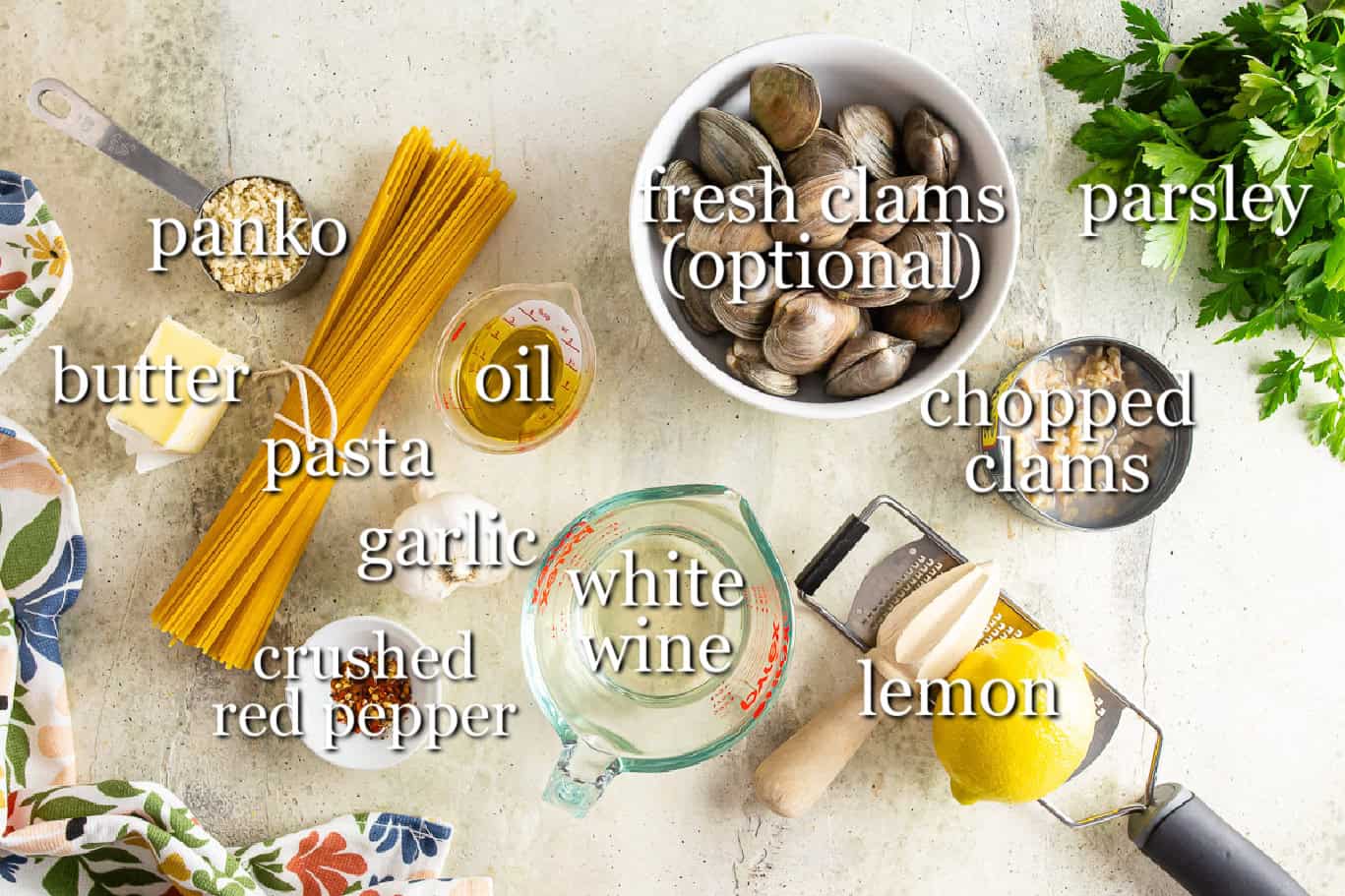 Ingredients for clam linguine in separate containers.