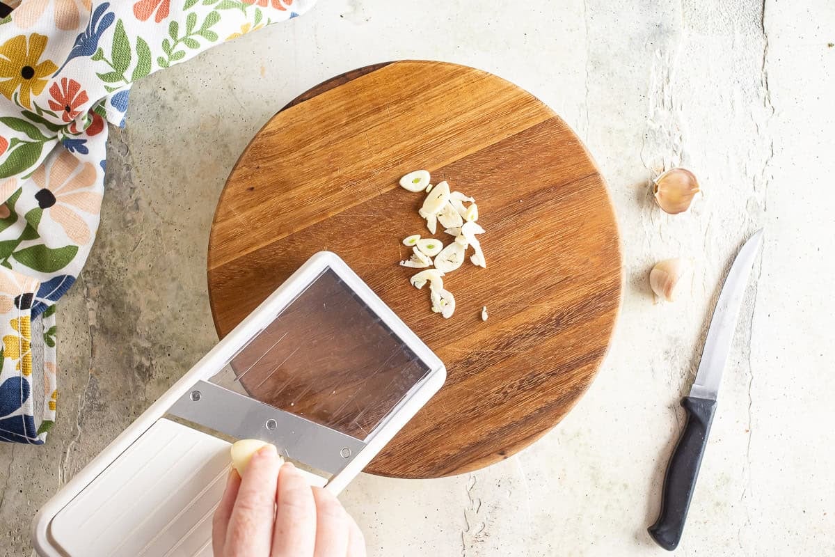 Slicing garlic for linguine with clam sauce