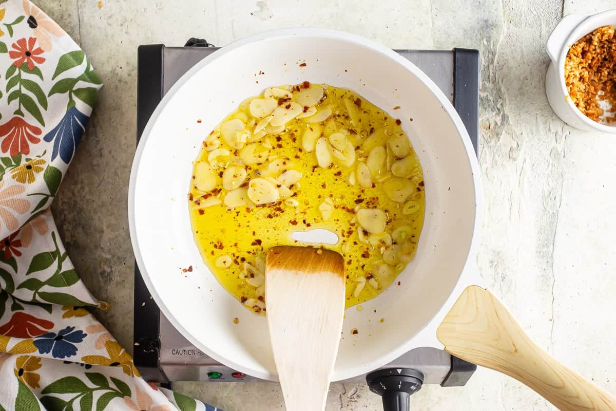 Making garlic chili oil for clam sauce and linguine.