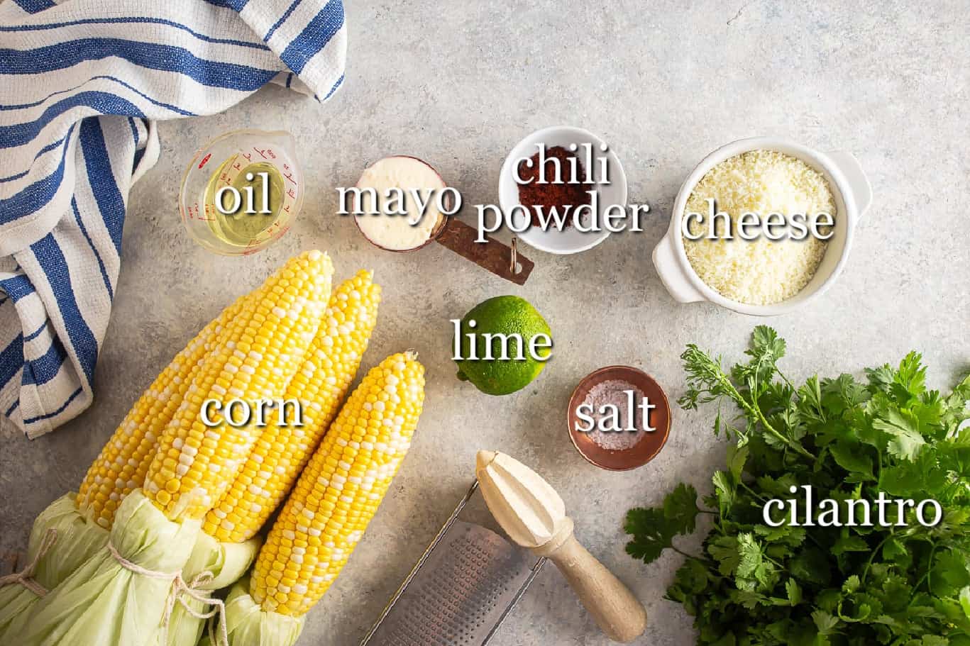Ingredients for elote on a gray background in separate containers.