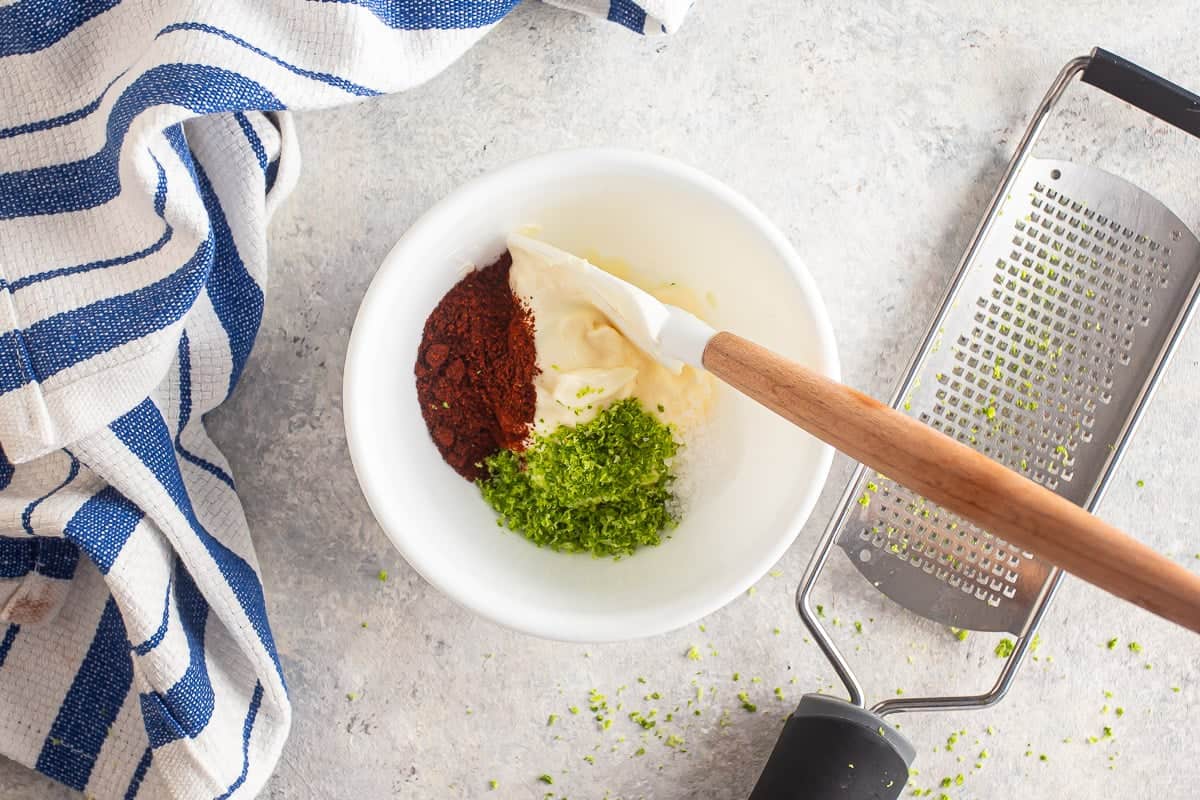 Making chili-lime mayo for elote.