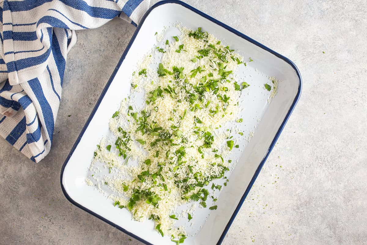 Cheese and cilantro on a tray for elote.