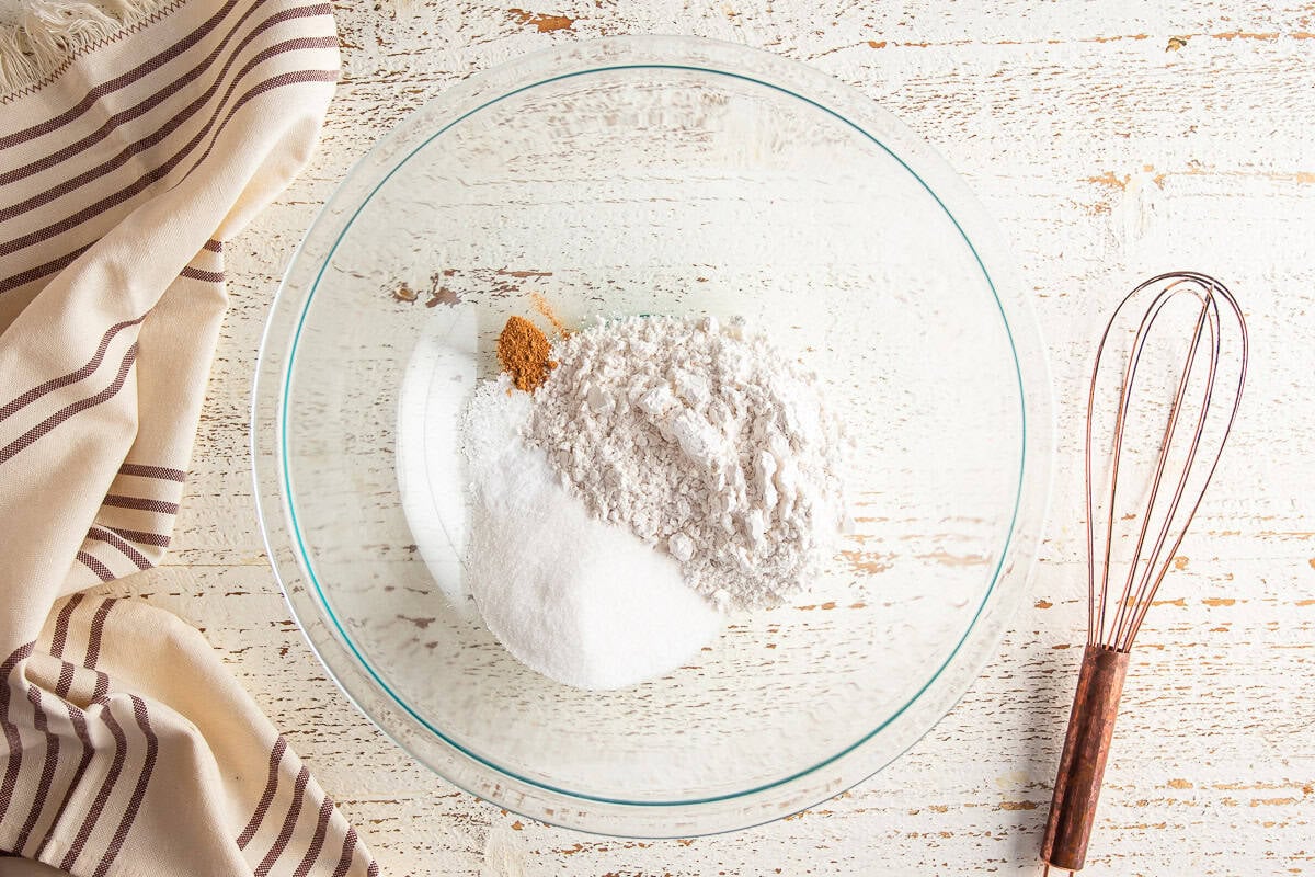 Mixing dry ingredients for baked cinnamon sugar donuts