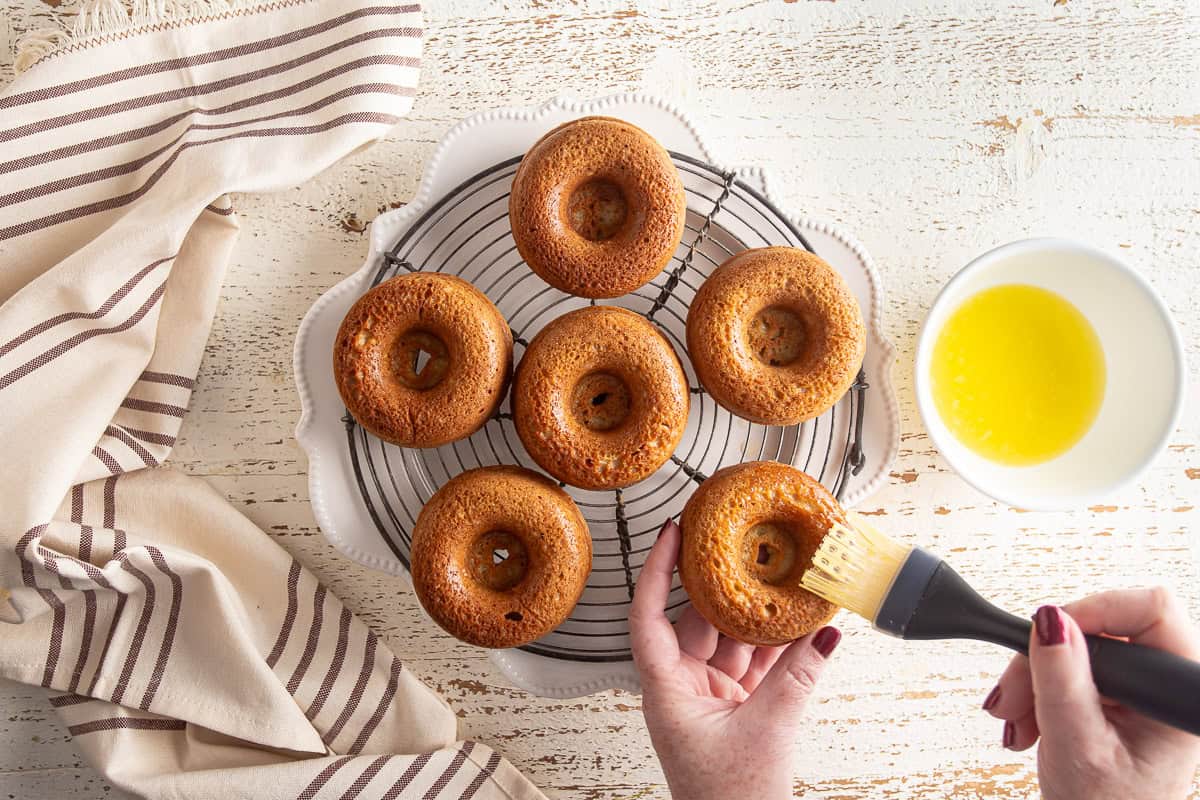 Baked cinnamon sugar donuts on a cooling rack