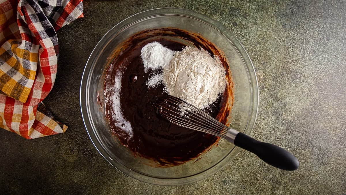 Adding dry ingredients to brownie batter