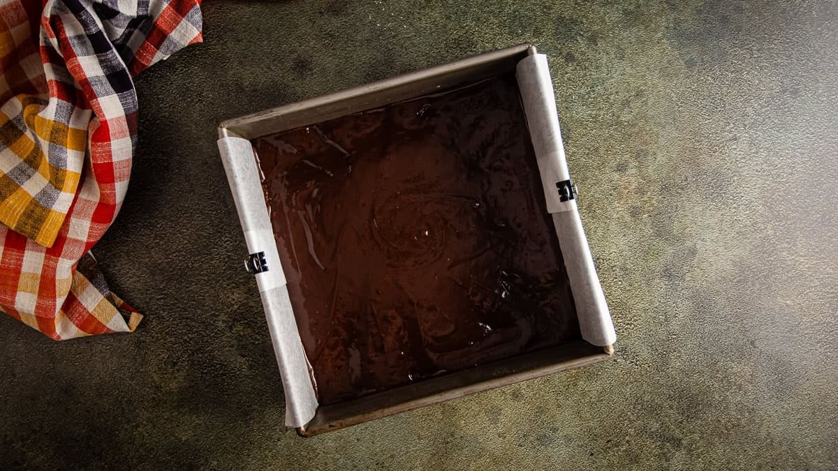 The brownie layer for pumpkin pie brownies before the pumpkin layer is added